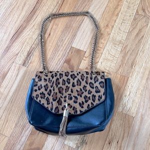 Boutique leopard animal print crossbody bag with faux fur and gold chain detail
